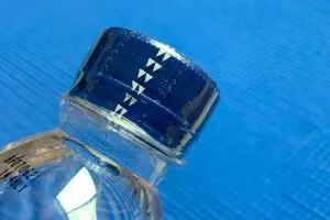 shrink band showing perforation for easy tearing - tamper evidence